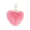 Verleihe deinem Look mit dem pinken, flauschigen Herz-Anhänger Glamour - goldene Details setzen stylishe Akzente!.
