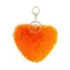 Entdecke dein neues Lieblings-Accessoire: Der flauschige Herz-Schlüsselanhänger in Orange mit goldenem Ring - stylish & trendy!.