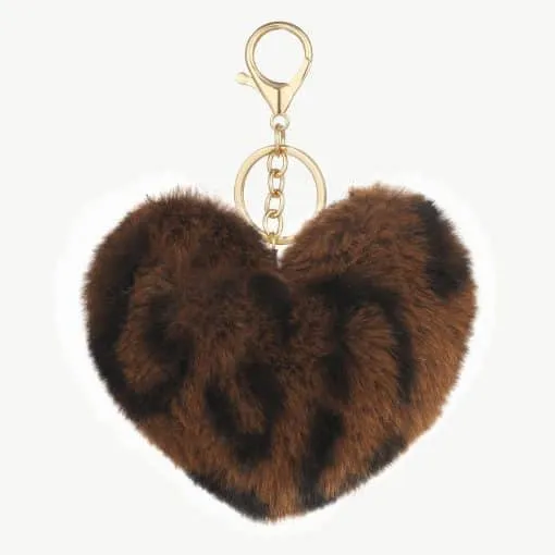 Verleihe deinem Look das gewisse Etwas: Der Plüsch-Liebes-Schlüsselanhänger in Braun und Schwarz mit goldenem Ring verzaubert dich!.