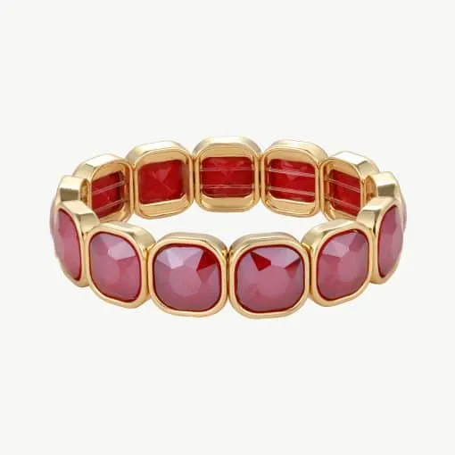 Erlebe puren Luxus: Dieses moderne Goldarmband mit leuchtend roten Edelsteinen lässt deinen Look stilvoll erstrahlen.