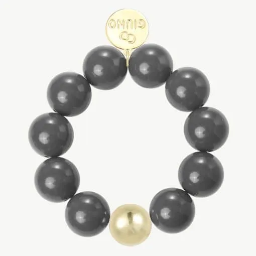 Setz ein Statement: Dein rundes Armband mit großen schwarzen Perlen, einem goldenen Akzent und 