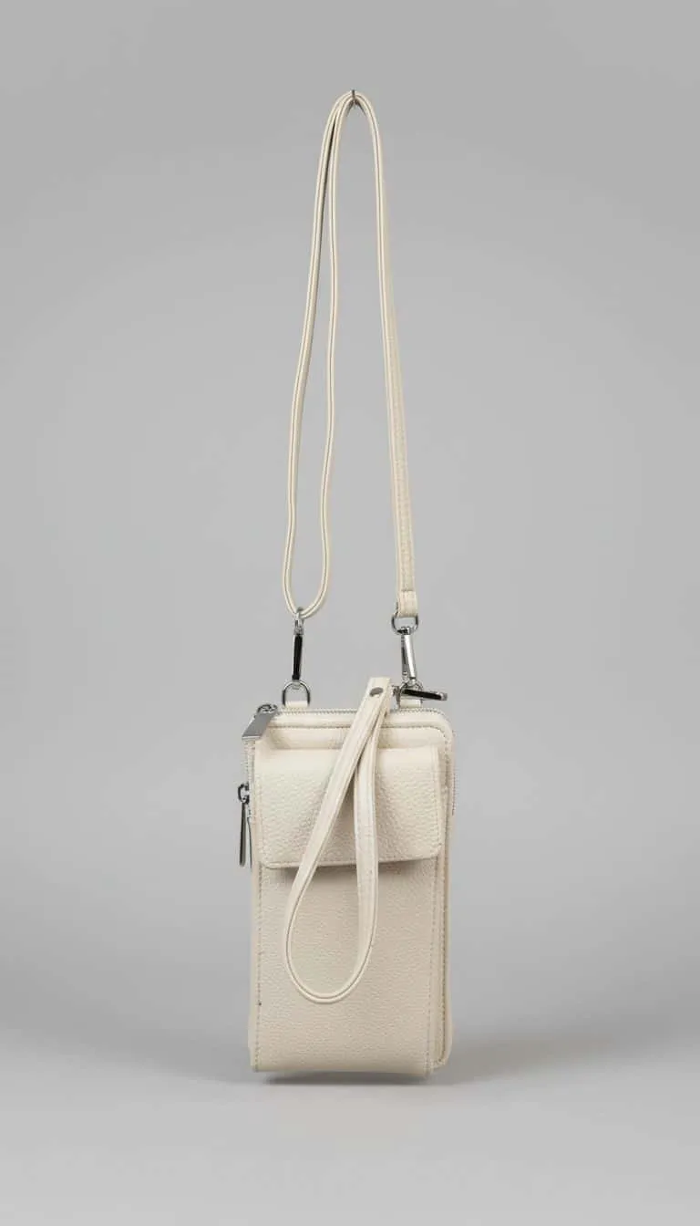 Setze ein Statement mit deiner neuen, cremefarbenen Crossbody-Bag - modern, stylisch und perfekt für deinen Alltag!.
