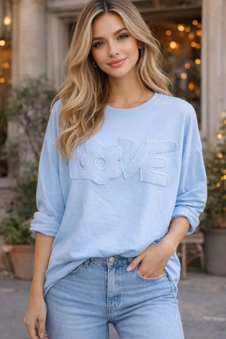 Soft & Full of LOVE Sweatshirt. Light blue, long-sleeved sweatshirt featuring textured 